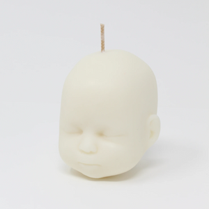 Doll head shaped candle in white