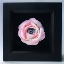 Load image into Gallery viewer, pink fabric rose with blinking grey doll eye peeking out the middle with two tears running down the rose petals, mounted in square black box frame