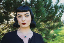 Load image into Gallery viewer, Pin up model in nature wearing eyeball necklace with green blue iris