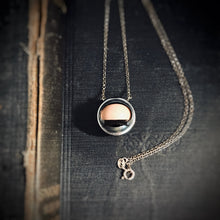 Load image into Gallery viewer, Image showing the necklace laying down, meaning the eye is closed. 