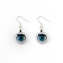 Load image into Gallery viewer, Blinking doll eye earrings shown on plain white background, earrings are made with vintage style doll eyes with blue irises. 