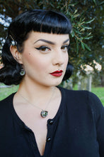 Load image into Gallery viewer, pin up model with classic makeup wears matching green doll eye necklace and earrings