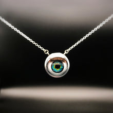 Load image into Gallery viewer, Silver necklace with doll eye pendant and green and blue iris, with long eye lashes