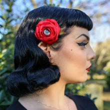 Load image into Gallery viewer, Large red rose with grey eye hair accessory worn by model with pin up/ rockabilly style