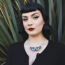 Load image into Gallery viewer, spider necklace being worn by alt/ pin up/ goth model 