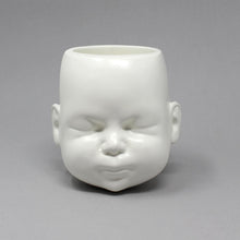 Load image into Gallery viewer, White pot in the shape of a doll head on grey background