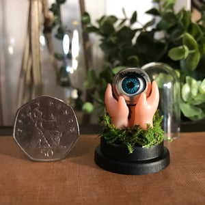 doll eyeball artwork. unsual creepy minature dome memento mori