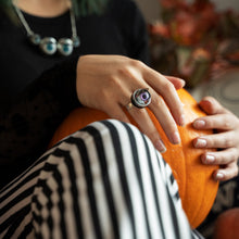 Load image into Gallery viewer, purple ring being worn by model in autumnal theme, model is holding a pumpkin and wearing black and white striped trousers